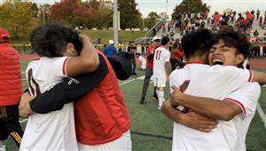 Two sets of players hug in celebration.